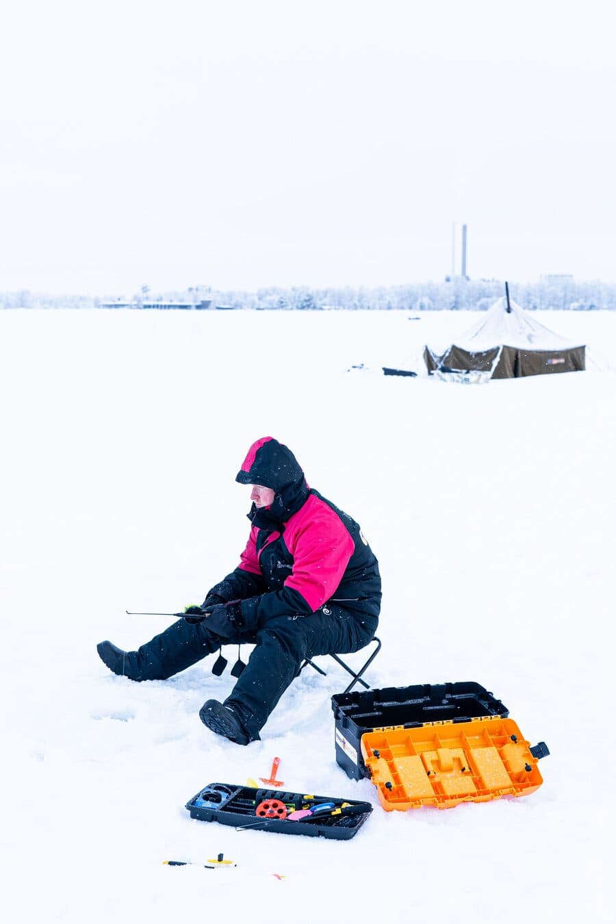 Perttu ice fishing on a frozen sea