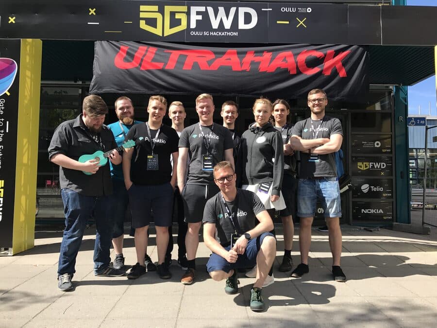 Perttu's team posing in front of the Ultrahack banner at Oulu 5GFWD